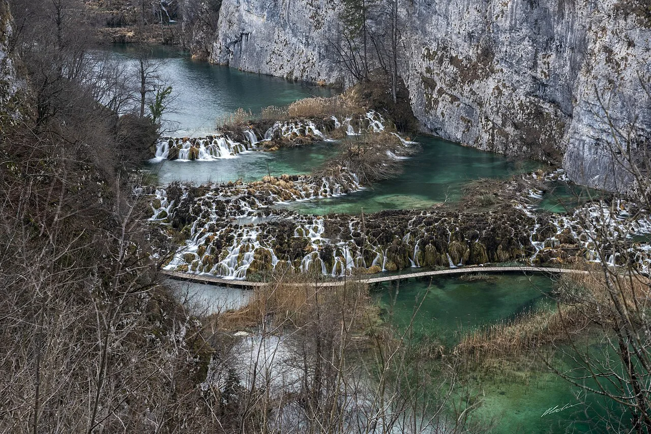 Small waterfalls spilling between terraced lakes in Plitvice Lakes National Park, Croatia
