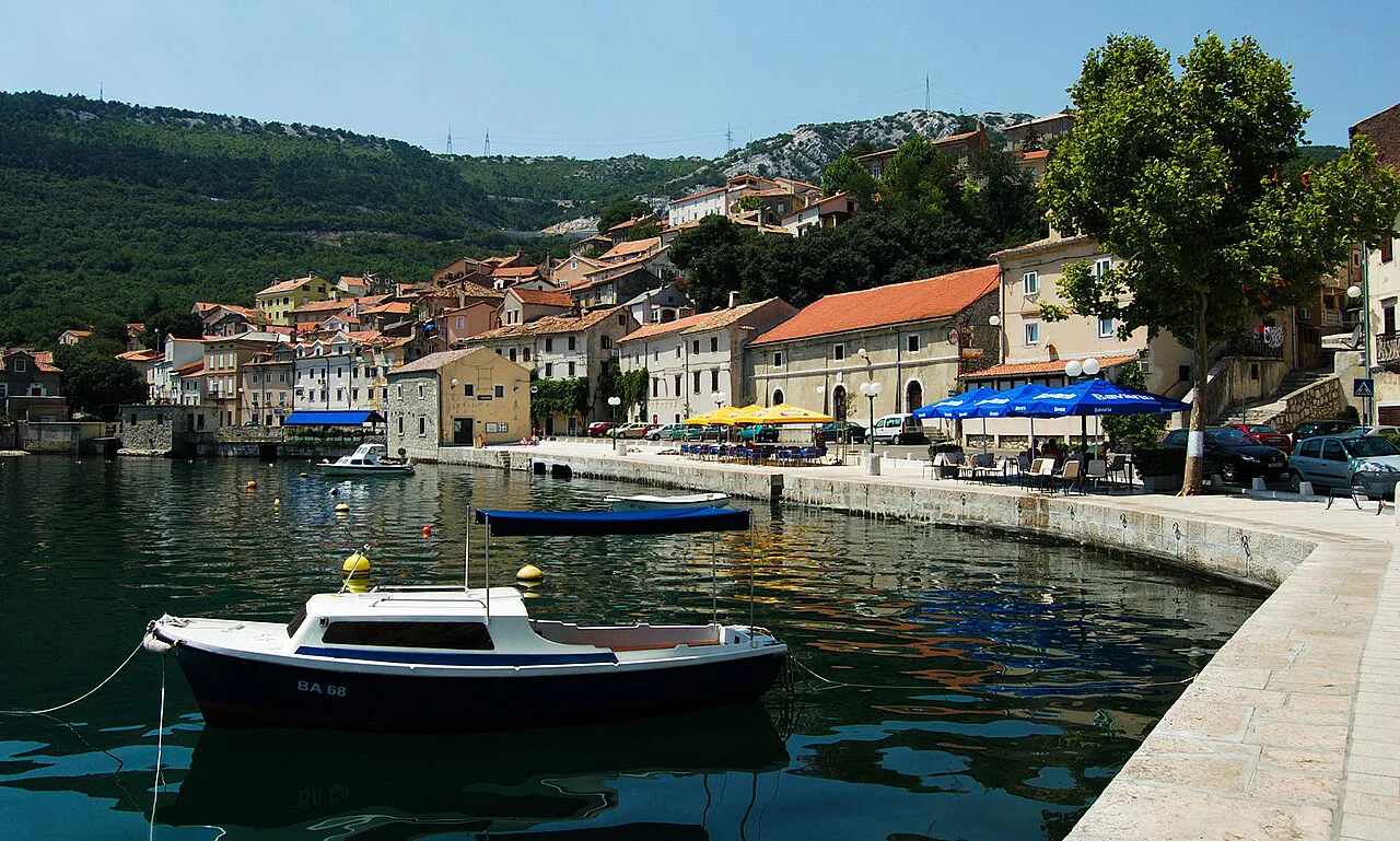 Small boats moored along the waterfront of the old town of Bakar, Kvarner