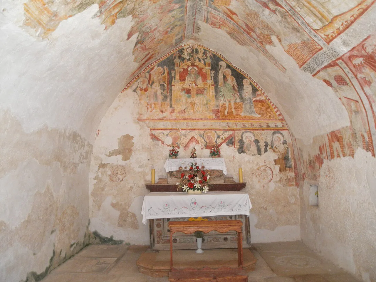 Wall paintings and an altar inside the Holy Spirit chapel in Bale, Istria