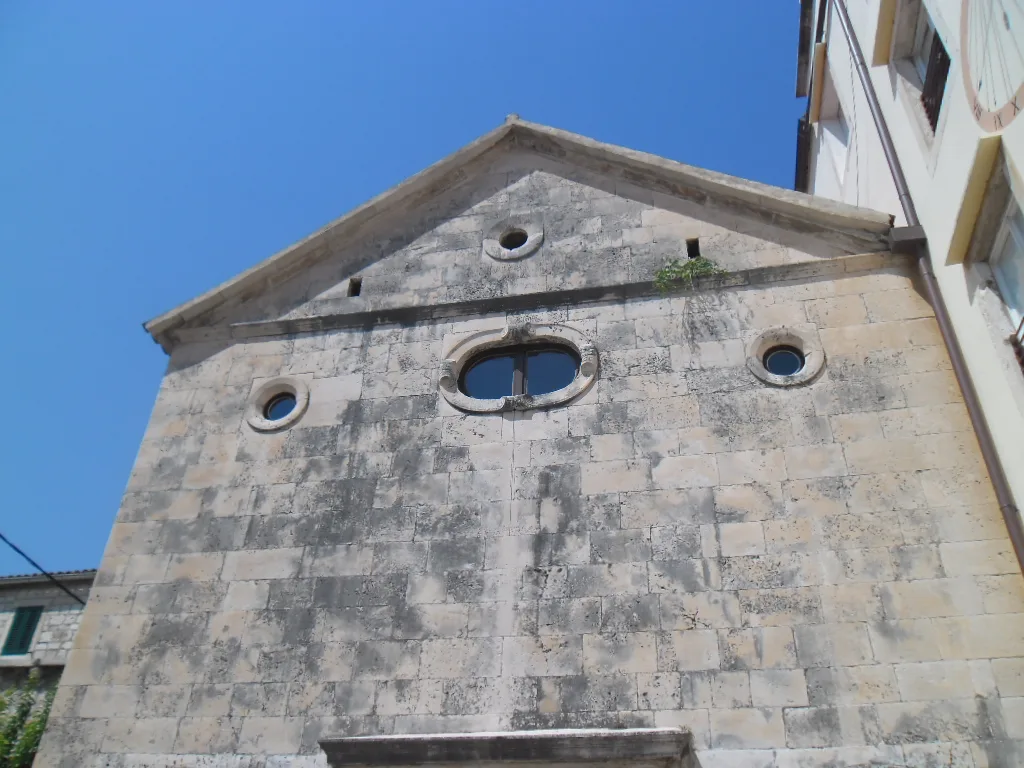 The stone gable façade of the Benedictine nunnery church in Hvar Town.
