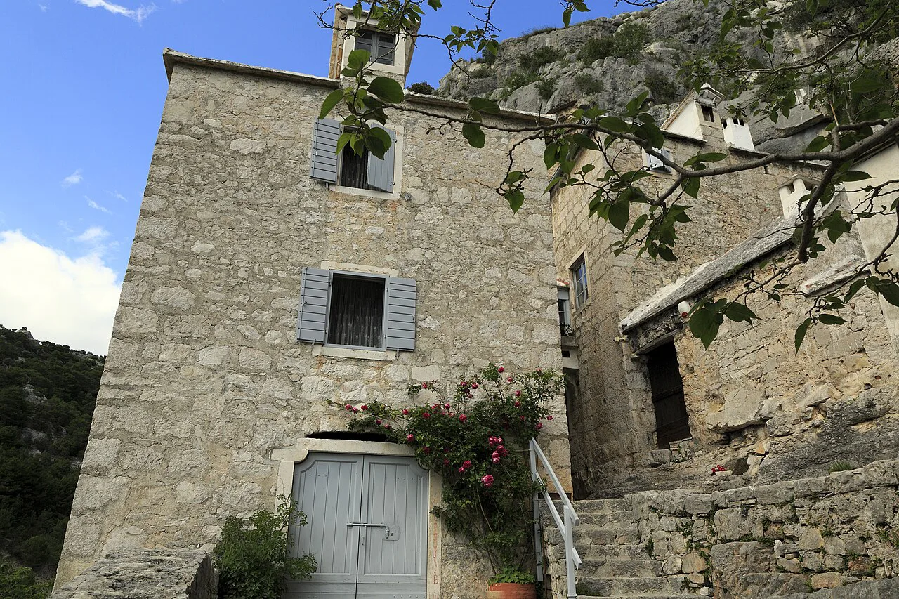 Stone buildings around the courtyard of the Blaca Hermitage on Brač