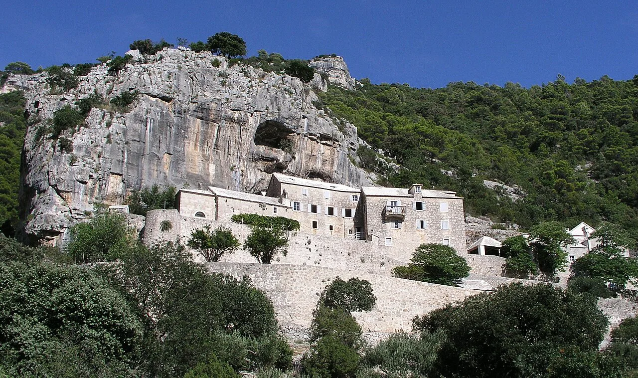 The Blaca Hermitage built against a limestone cliff on the island of Brač