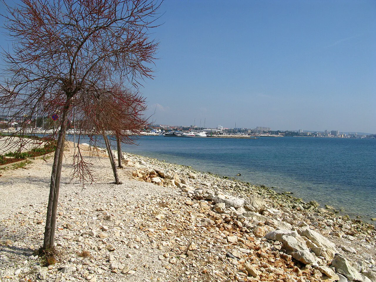 A pebble shoreline in Borik looking across the Zadar channel