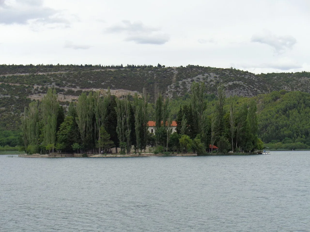Visovac Island with its monastery among trees on the lake in Krka National Park