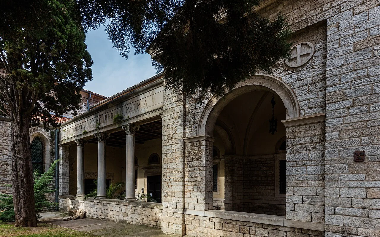 The arcaded side porch of Pula Cathedral in Pula