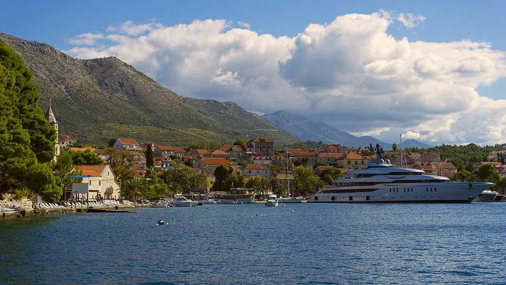 A large yacht in the bay in front of Cavtat and its mountains, Southern Dalmatia