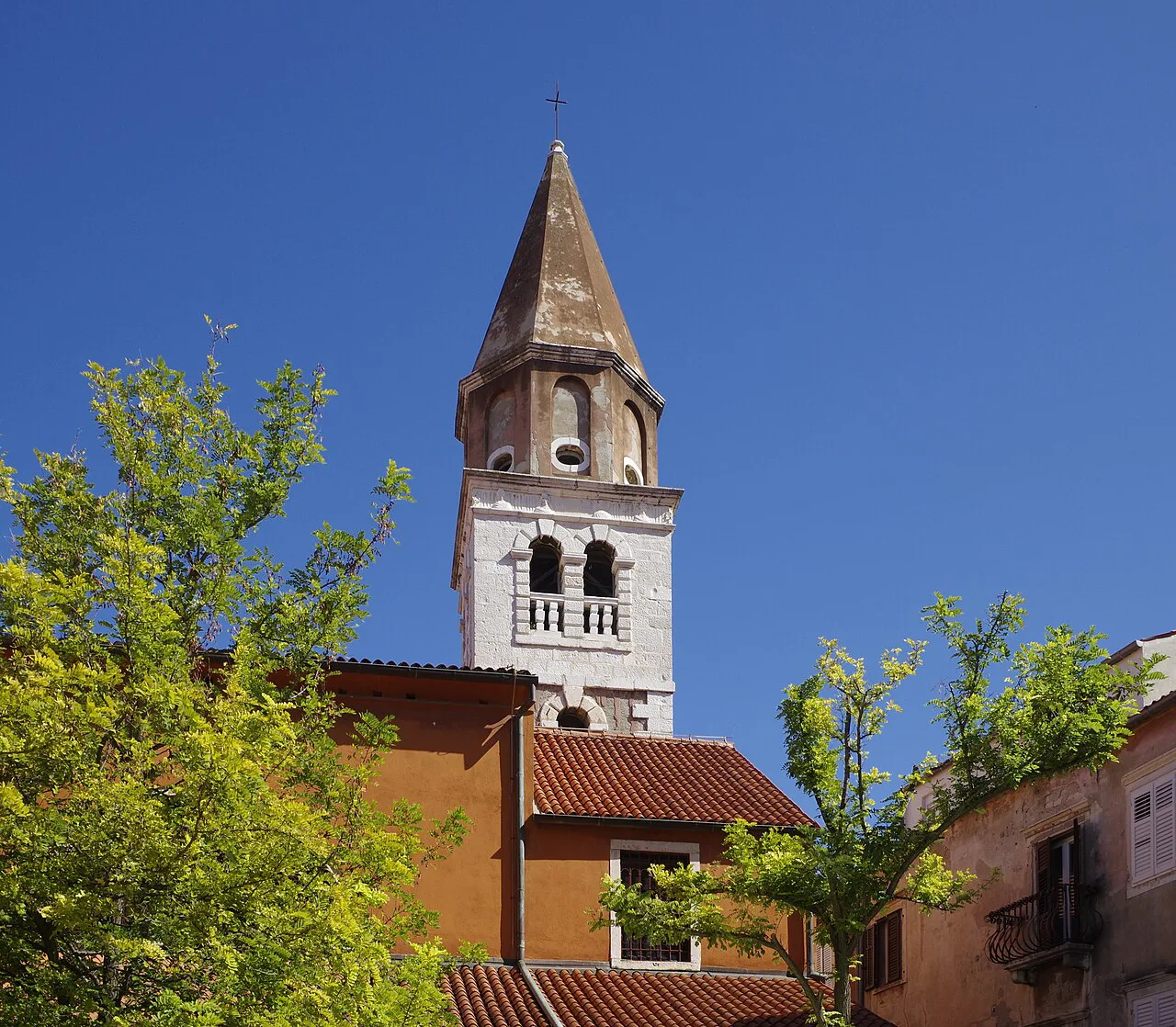 The bell tower of the Church of St Simeon above rooftops in Zadar