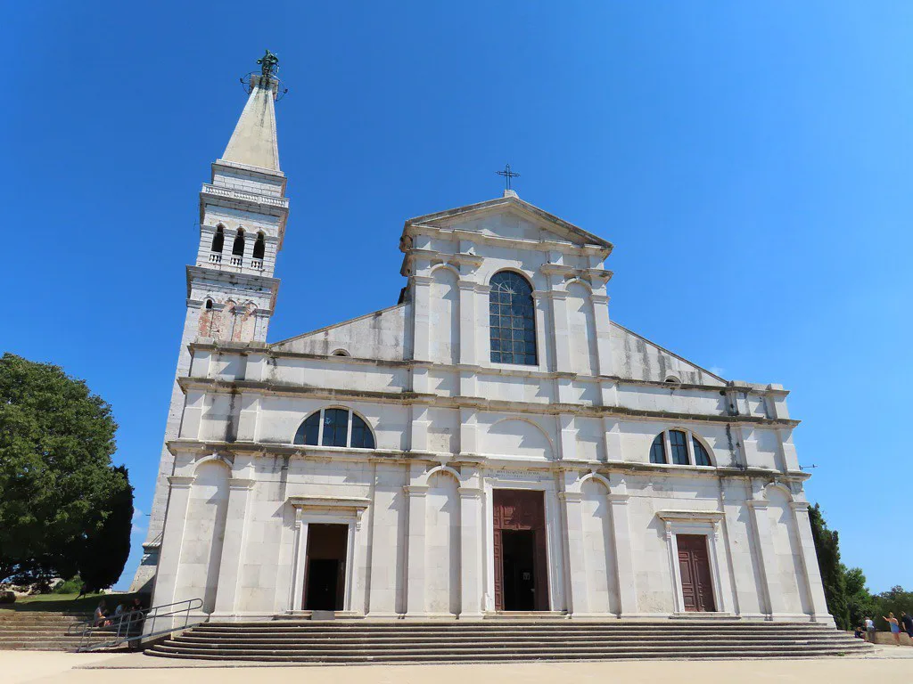 The white facade and bell tower of the Church of St Euphemia in Rovinj