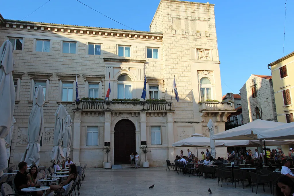 Zadar City Hall on Narodni trg with café tables in front