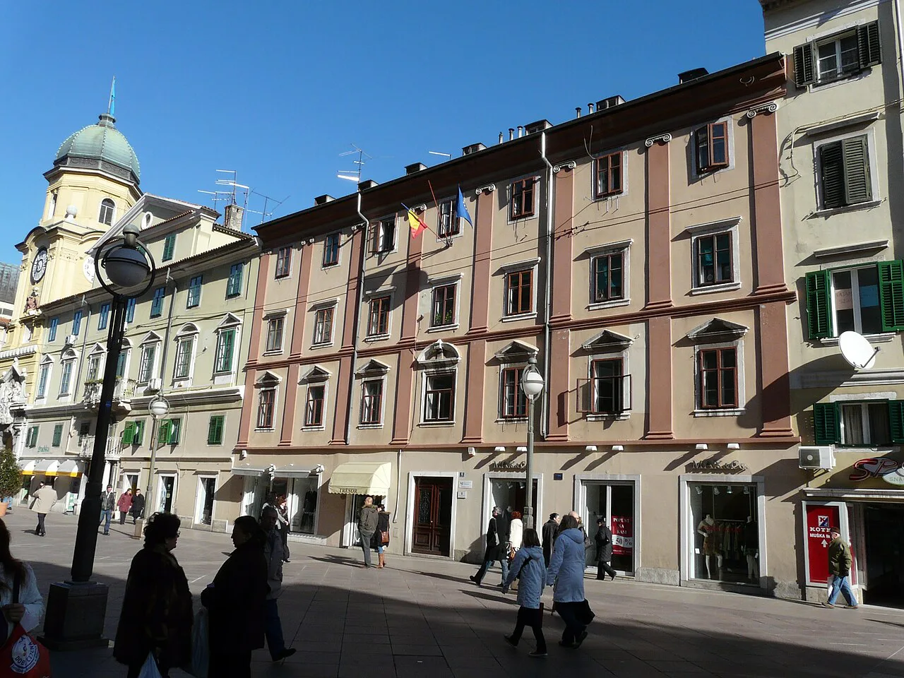 Pastel-coloured buildings along the Korzo in Rijeka, with the City Tower behind