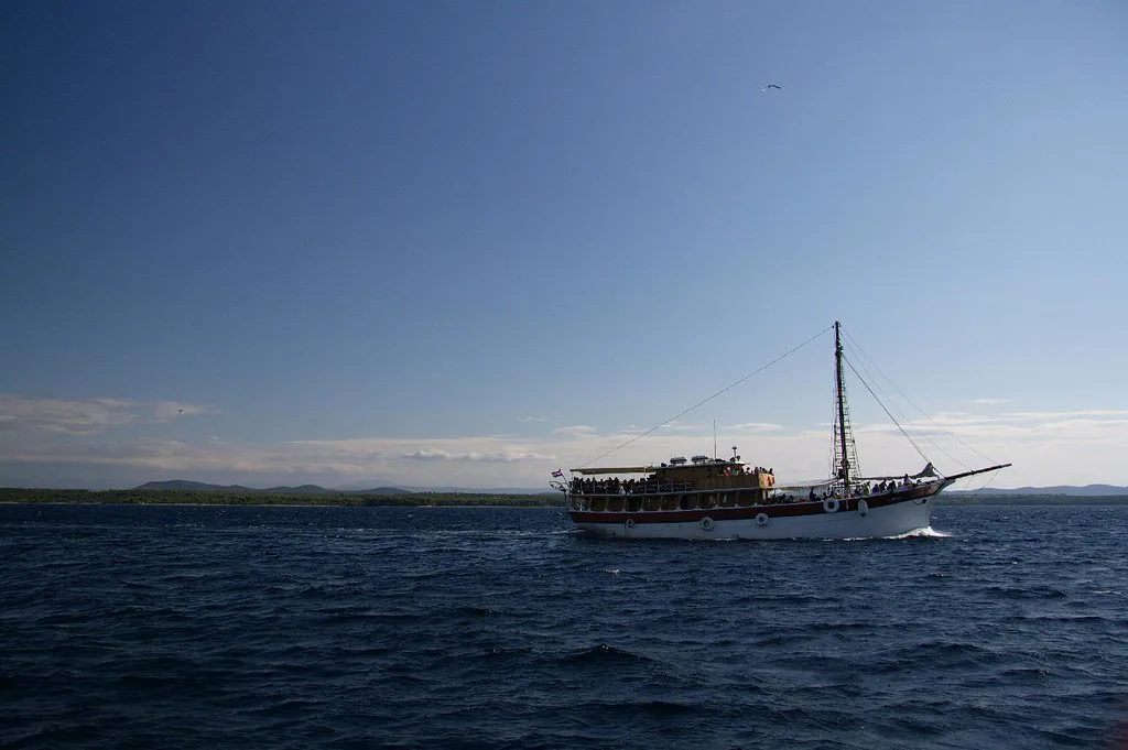 A wooden tour boat sailing on the sea near Biograd na Moru, Croatia