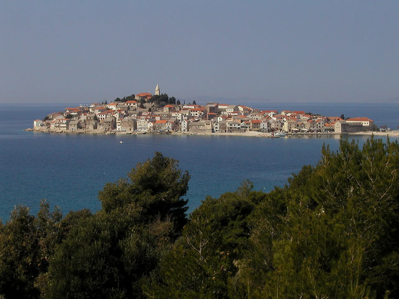 The town of Primošten on its peninsula, seen across the water, Croatia