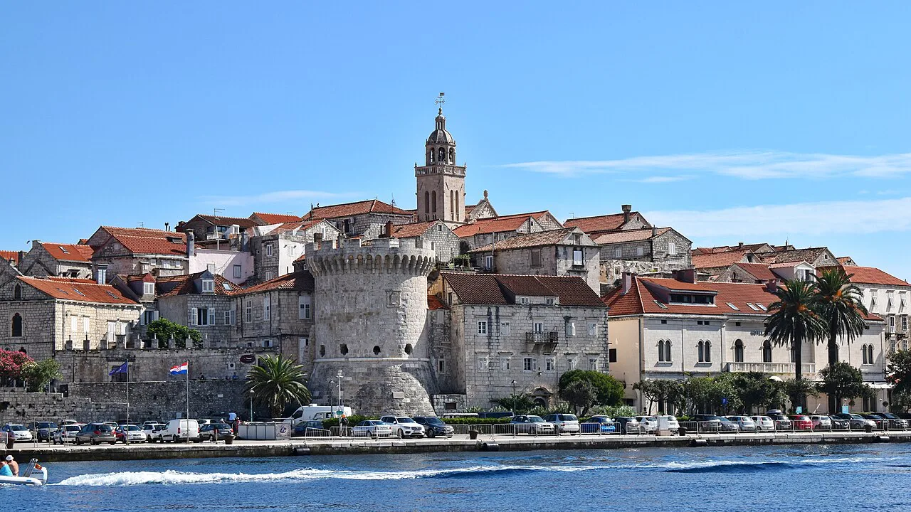 The walled town of Korčula with its cathedral tower beside the sea, Croatia