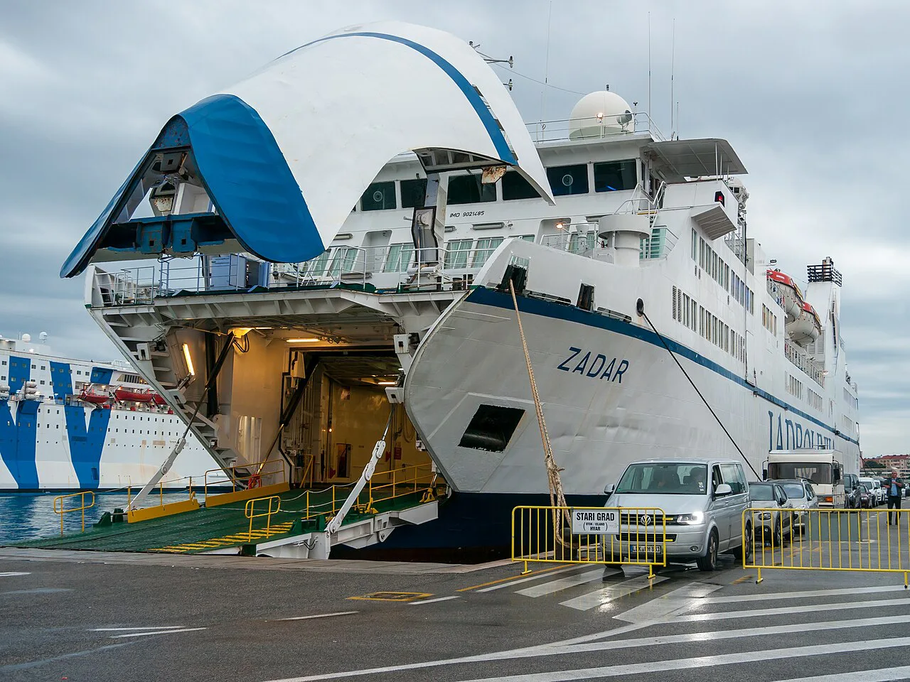 A roll-on roll-off ferry named Zadar docked in Split harbour with its bow open.