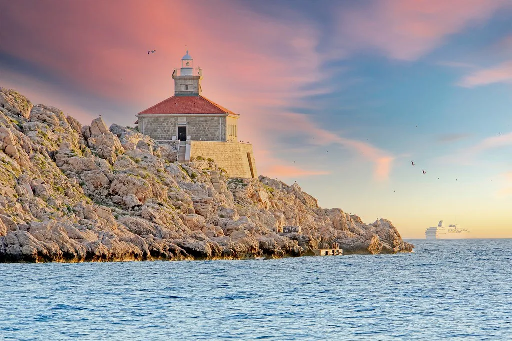 Grebeni lighthouse standing on a rocky islet above the Adriatic Sea, Croatia