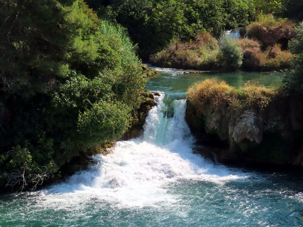 The Krka River flowing over a cascade in Krka National Park.