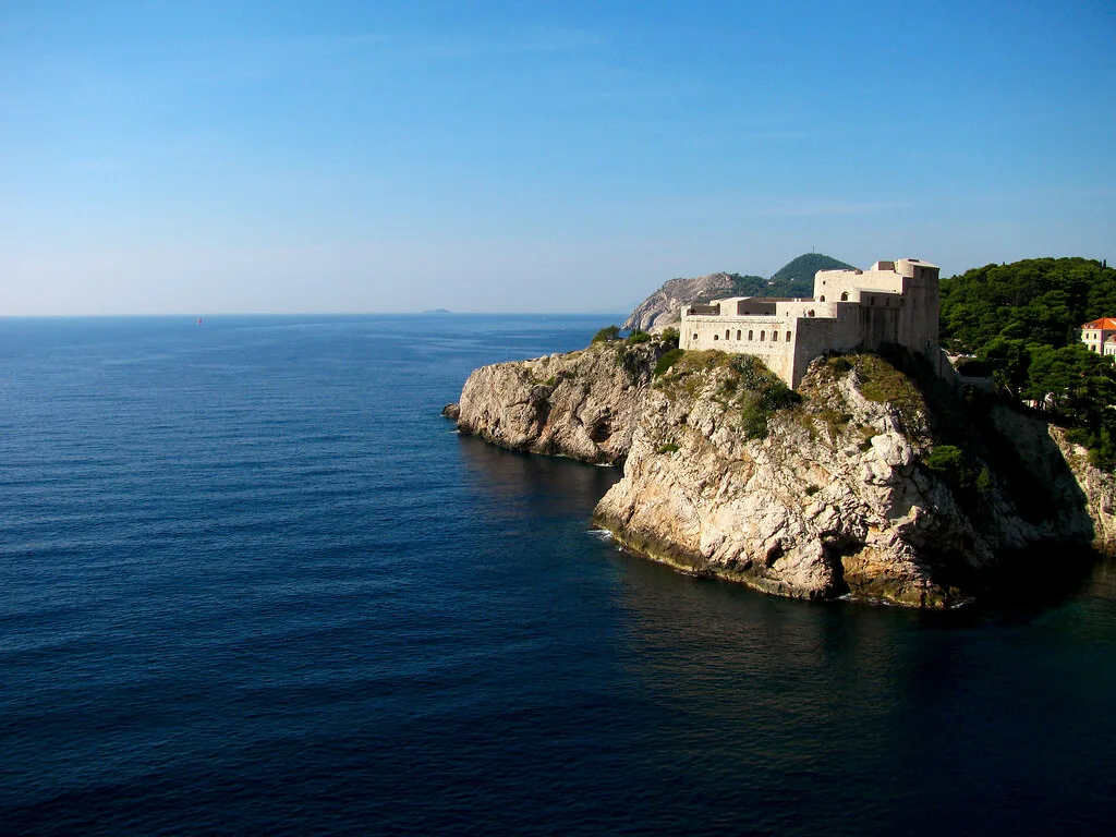 A stone fortress on a rocky headland above the sea in Dubrovnik.