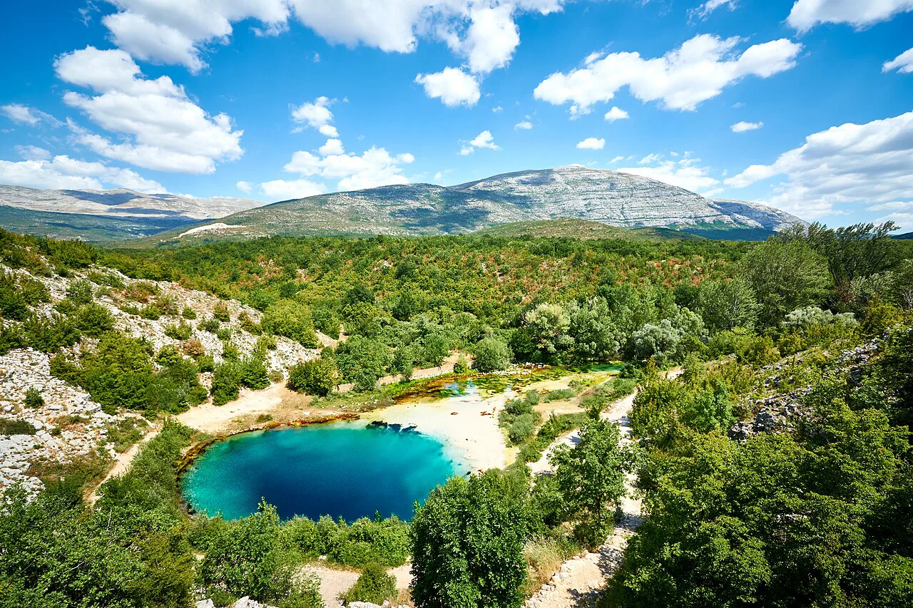 The Blue Eye spring of the Cetina river with the Dinara range behind.