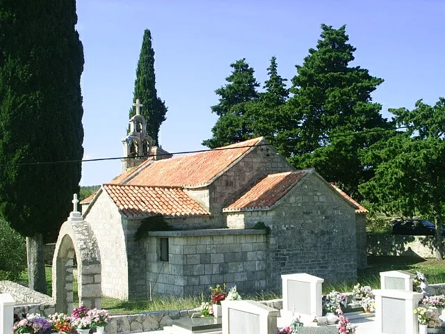 A small stone chapel beside a cemetery in the village of Humac on Hvar