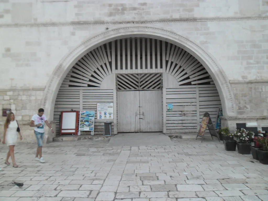 The large arched gateway of the Arsenal on the main square in Hvar Town