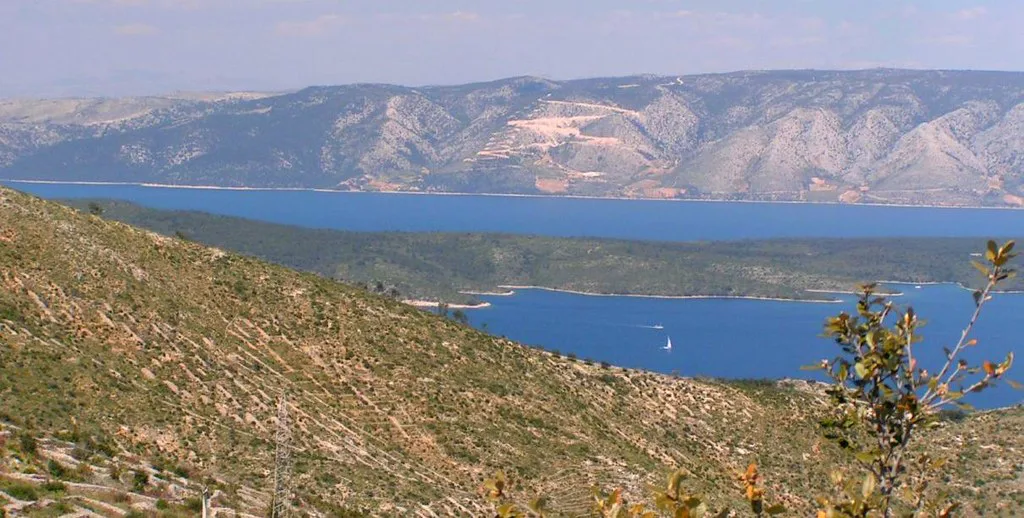 View from a hillside on the island of Hvar across the sea to the mountains