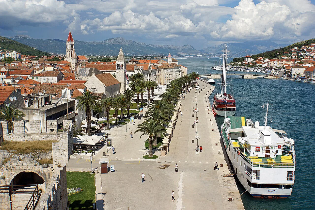 The Trogir waterfront promenade and moored boats seen from Kamerlengo Fortress, Dalmatia