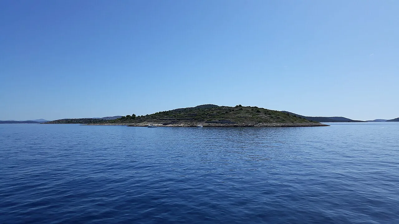 The westernmost point of Kaprije island seen across the sea, Šibenik