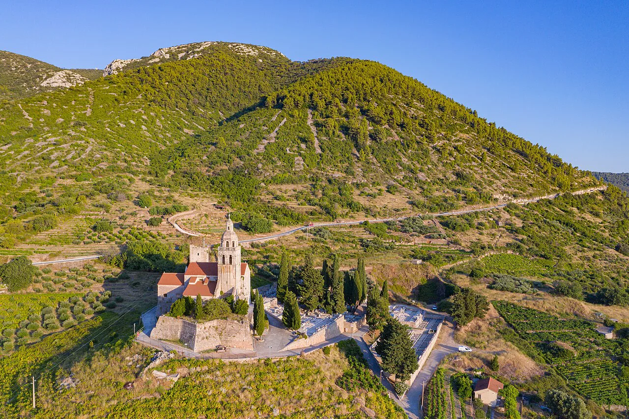 Aerial view of St Nicholas Church among vineyards above Komiža, Vis