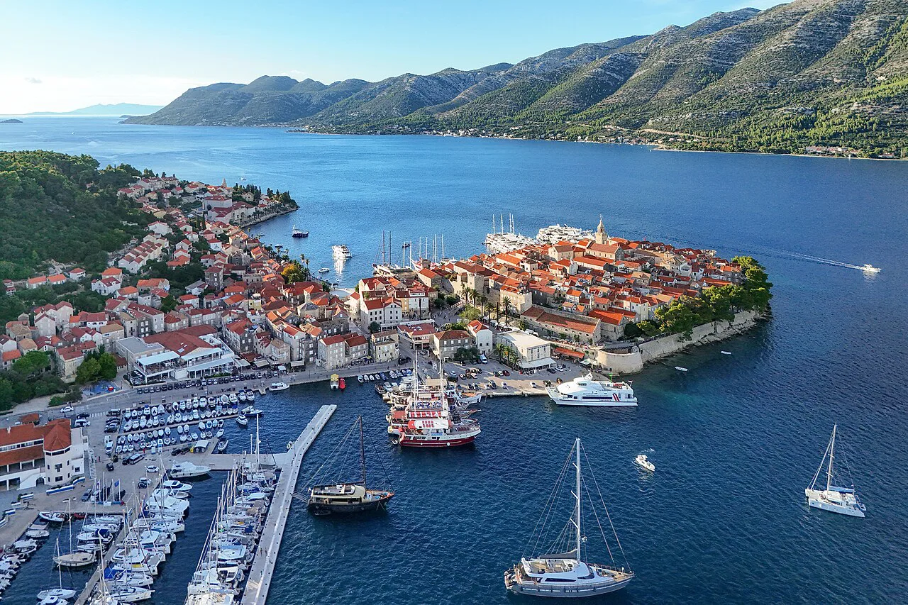 Aerial view of the walled old town of Korčula and its harbour.