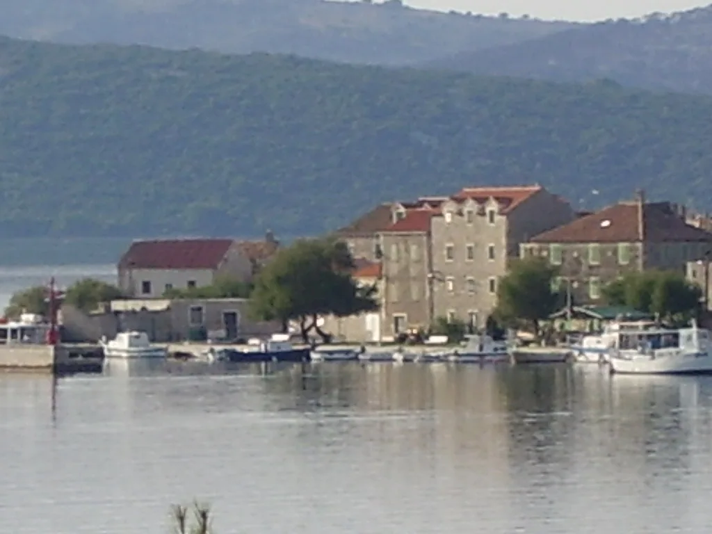 Stone houses along the waterfront on the island of Krapanj, Šibenik
