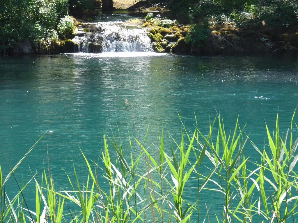 A waterfall feeding a turquoise pool in Krka National Park
