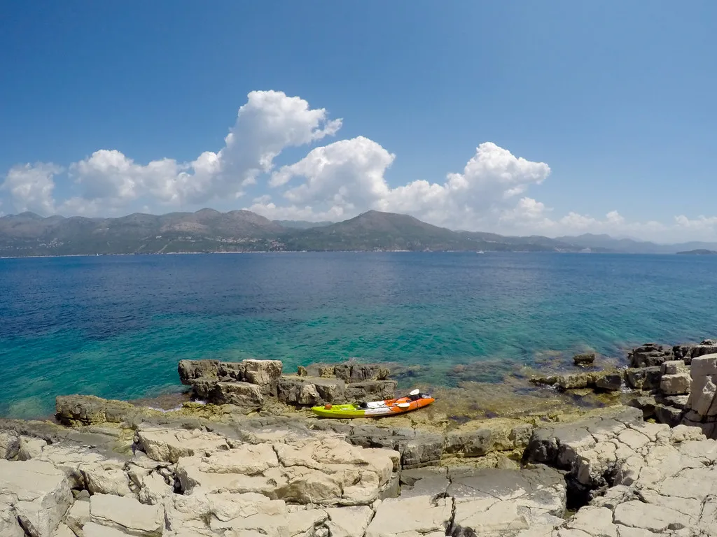 A kayak on the rocky shore of Lopud looking across the sea, Southern Dalmatia
