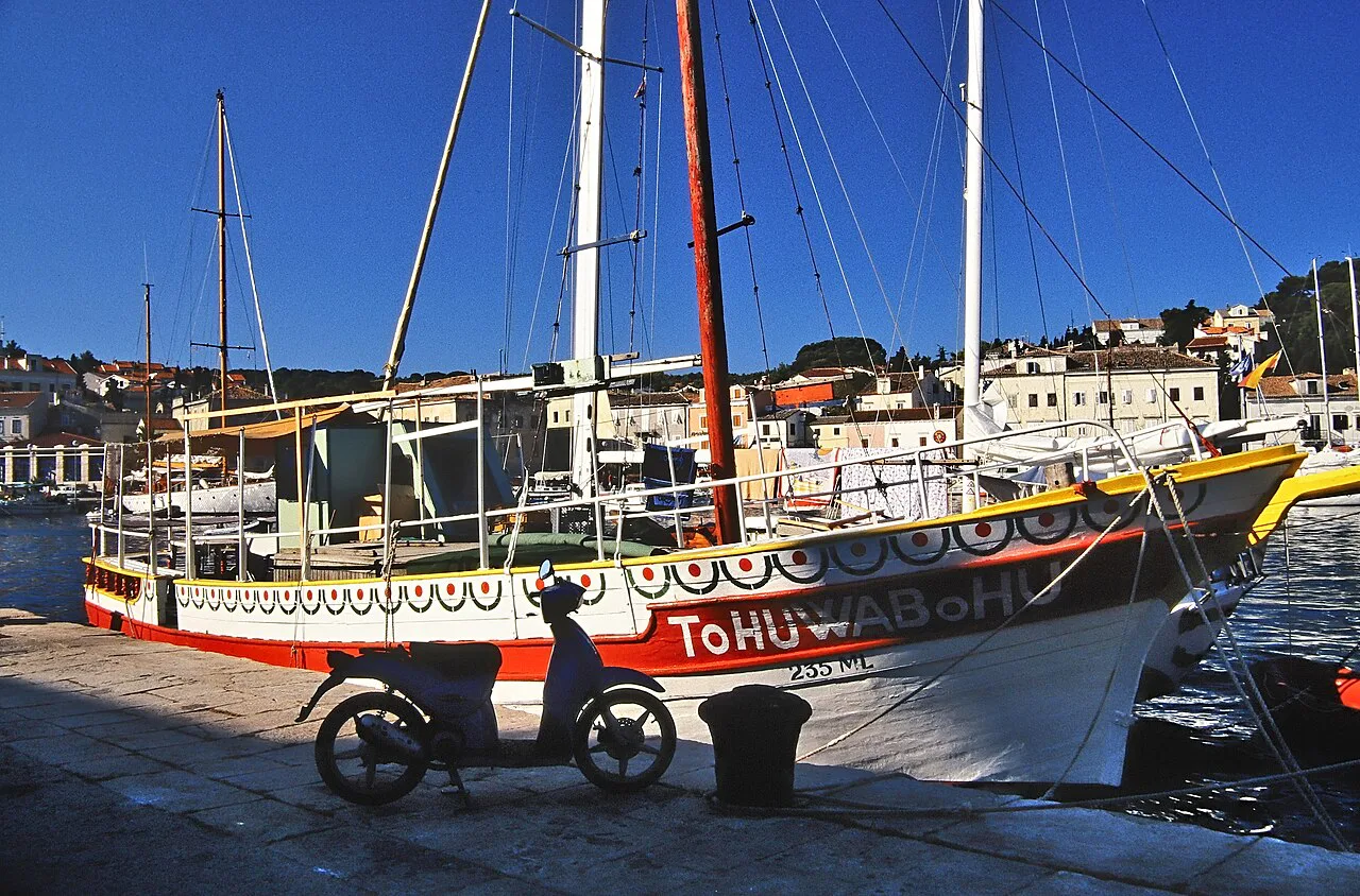 A painted wooden excursion boat moored at the quay in Mali Lošinj, Kvarner
