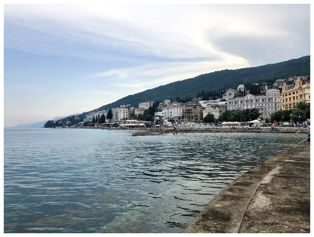 The seafront promenade curving along the bay at Opatija.