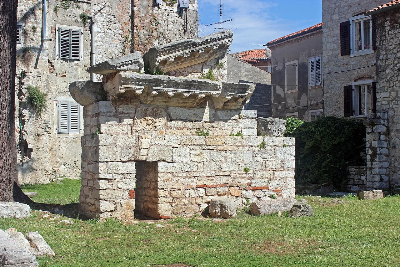 The ruins of the Roman temple among stone houses in Poreč