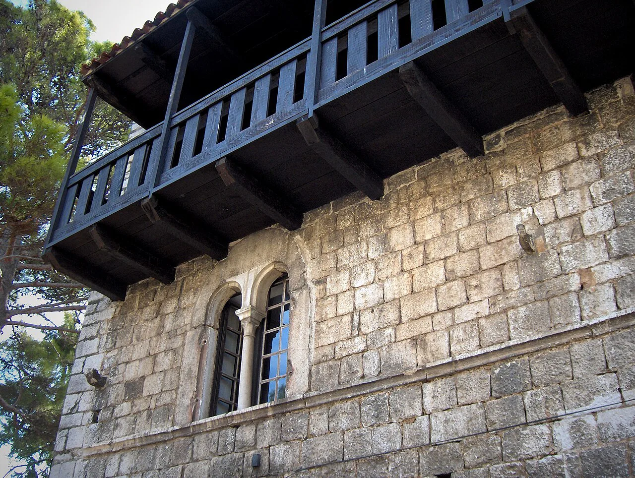 The wooden balcony of a 13th-century Romanesque house in Poreč.