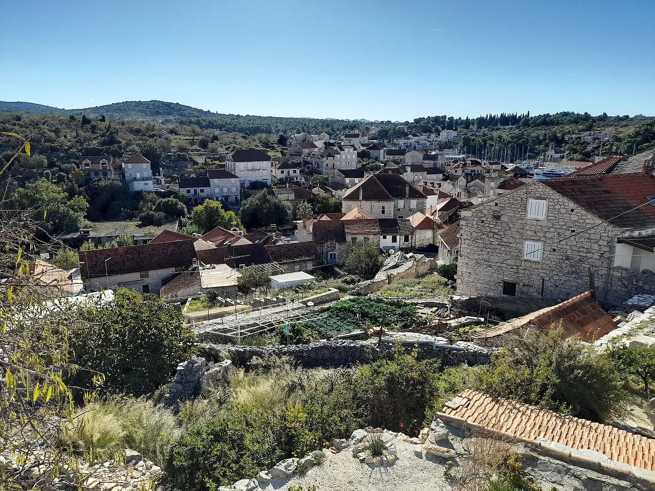 Stone houses and red roofs in the village of Milna on Brač