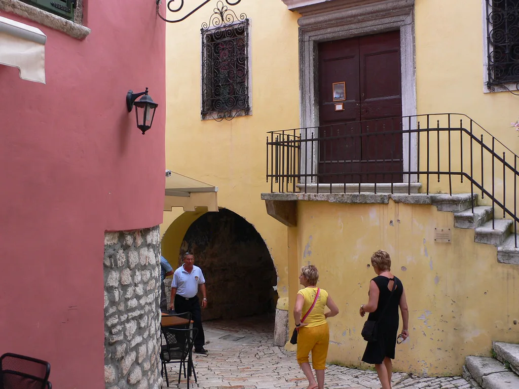 A colourful lane with an arched passage in Rovinj Old Town, Istria