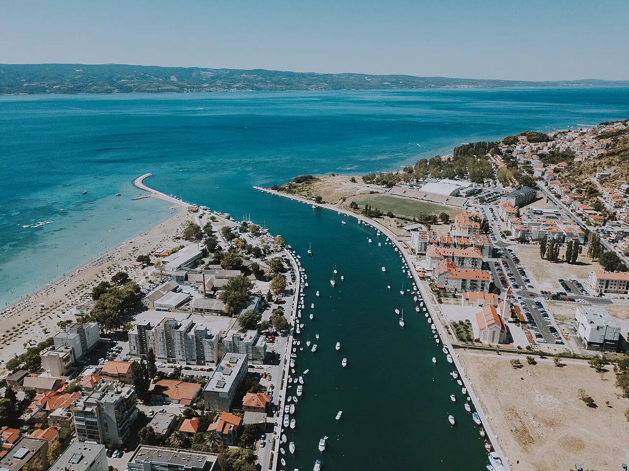 Aerial view of the Cetina river mouth and the town of Omiš beside the sea, Dalmatia