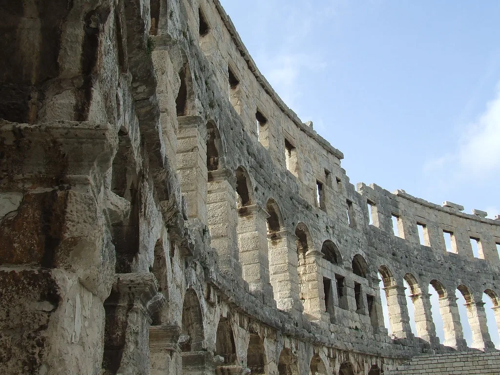 The curved stone arches of the Roman amphitheatre in Pula