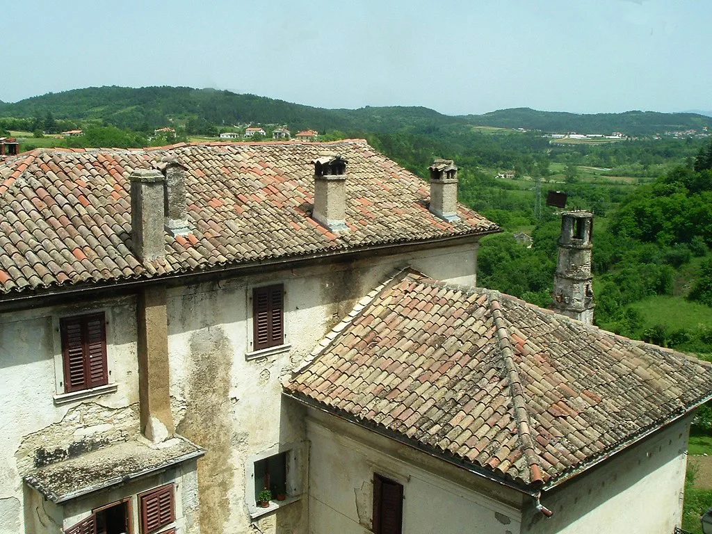 Old tiled-roof buildings in Pazin above the green Istrian countryside, Istria