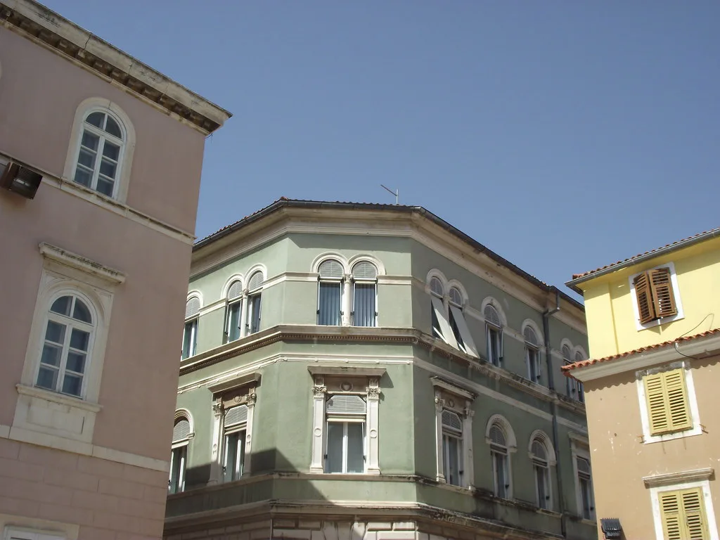 Historic buildings on a street in Zadar's old town peninsula.