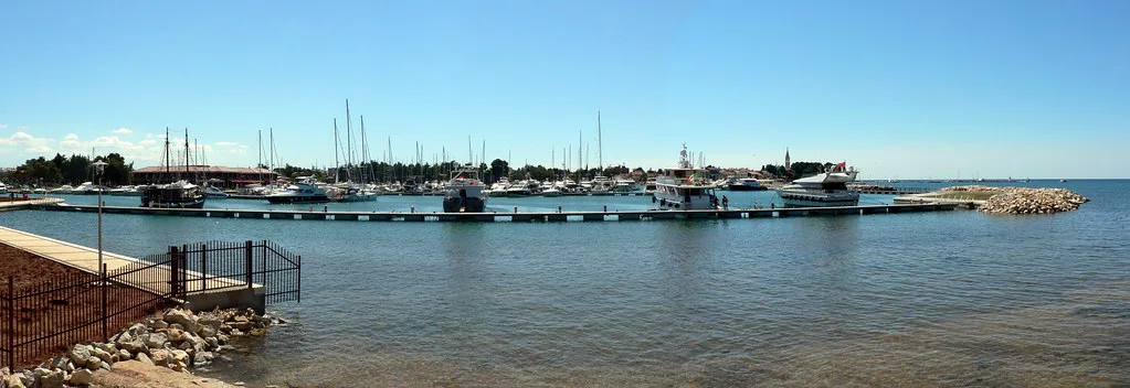 Boats moored in a marina on the coast just north of Poreč