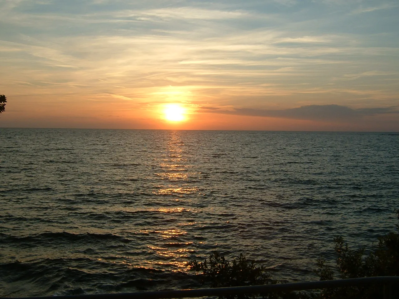The sun setting over the sea at Poreč