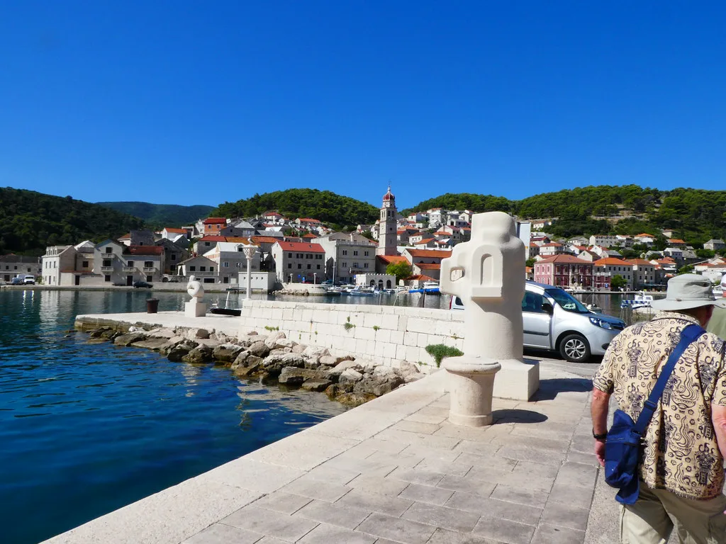A stone quay and waterfront houses in Pučišća on the island of Brač