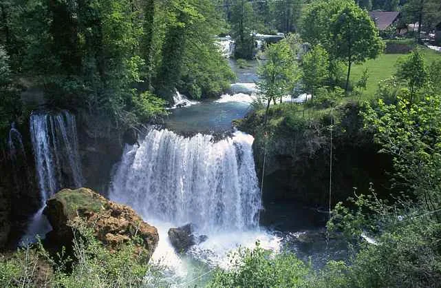 Water tumbling over rocks between old buildings in Rastoke near Slunj, Plitvice Lakes