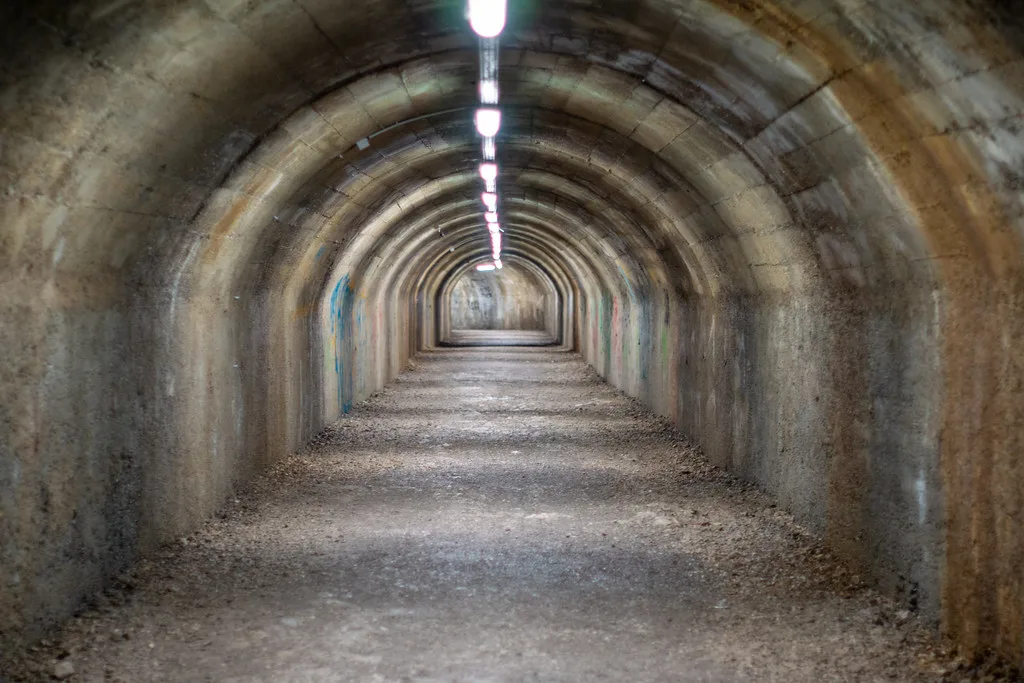 The long lit passage inside the Rijeka Tunnel, a former wartime shelter beneath Rijeka