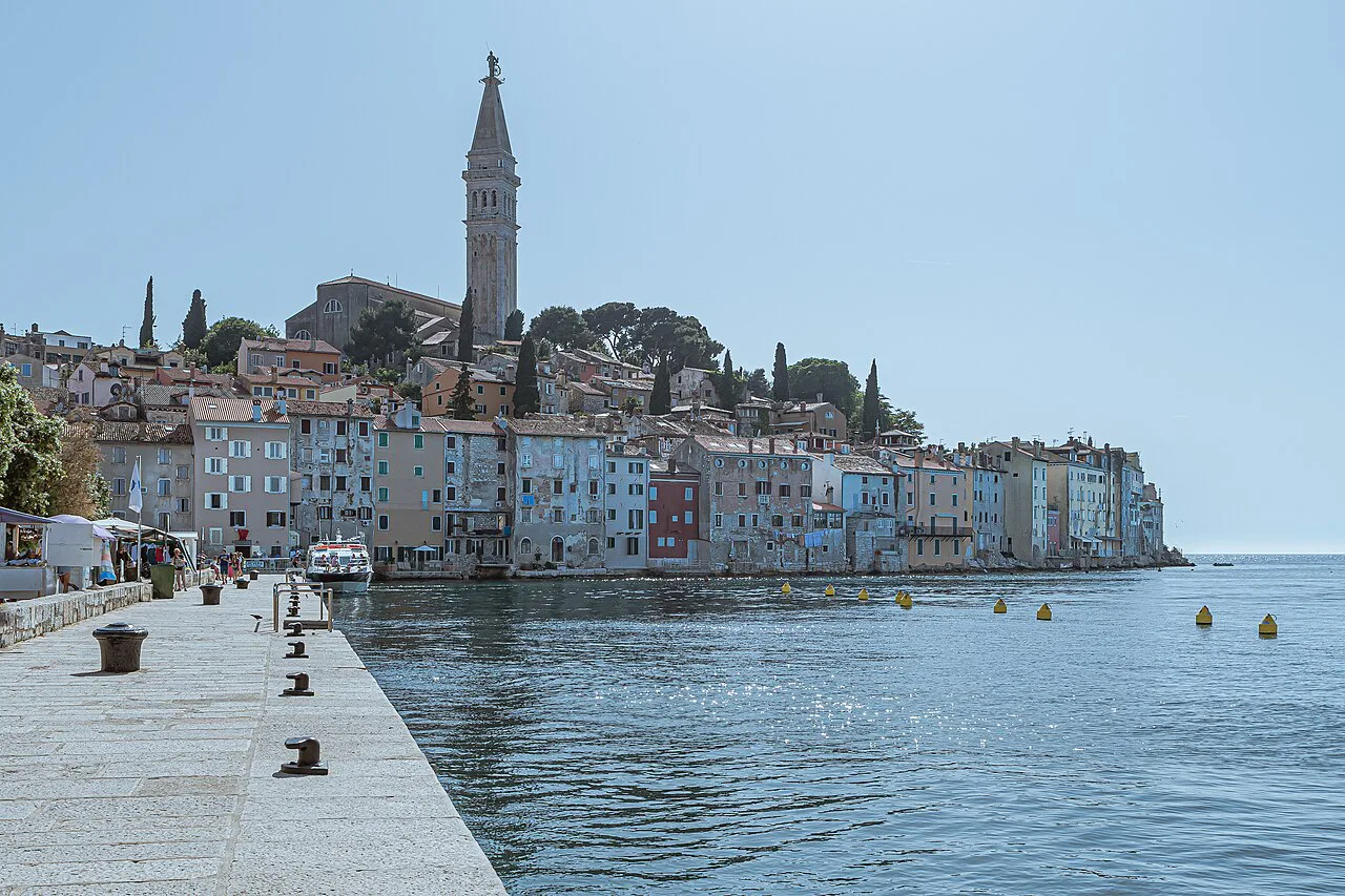 The old town of Rovinj and the bell tower of St Euphemia seen from the Valdibora pier