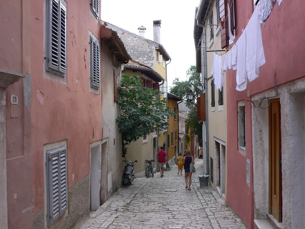 A narrow cobbled lane between colourful houses in Rovinj's old town, Rovinj