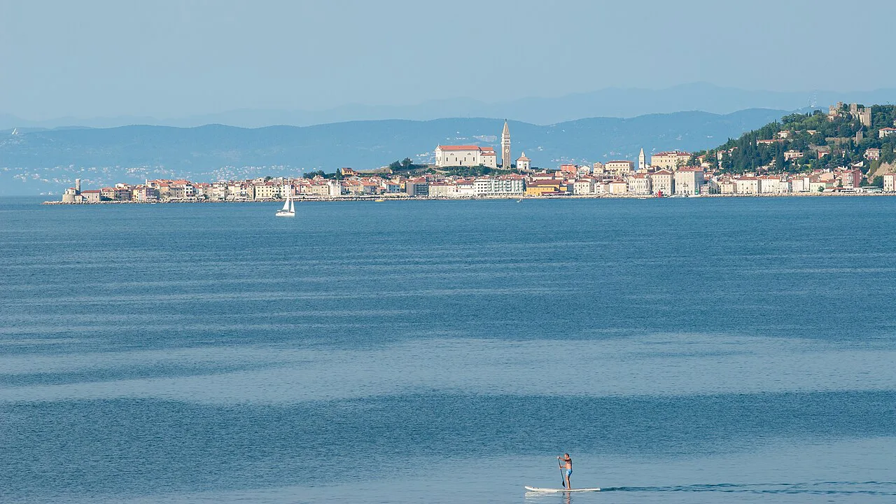 The town of Piran across the bay, seen from the coast at Savudrija, Istria